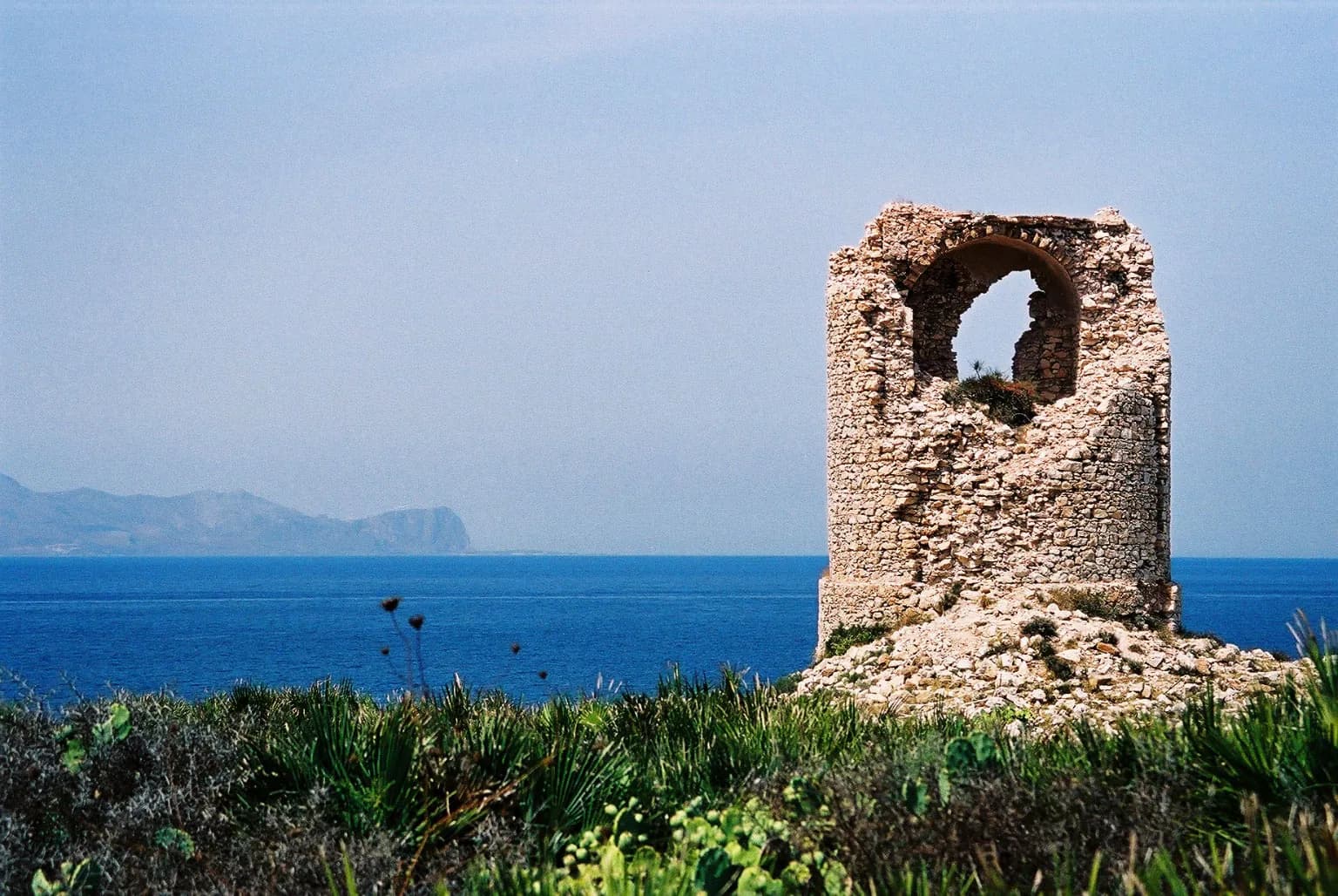 The sixteenth-century watchtower at Capo Rama on its headland above the sea