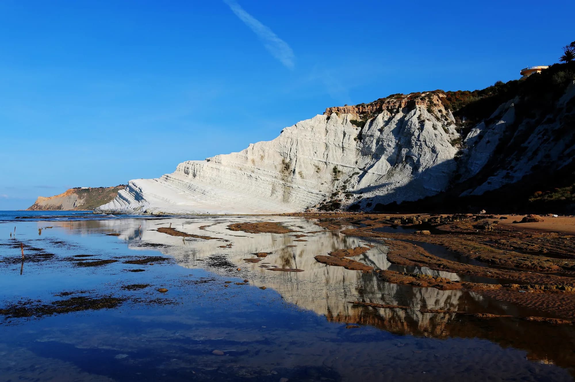 The white marl staircase of Scala dei Turchi against the sea